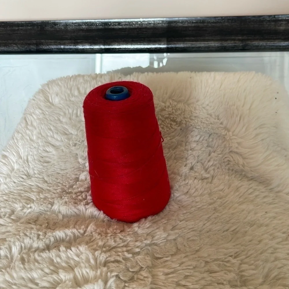 A spool of red cotton for sewing and crochet work basically new and vintage